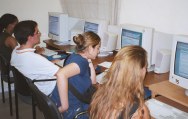 People seated looking at computer screens