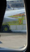 Window with yellow truck outside