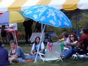 People on the lawn under beach umbrellas