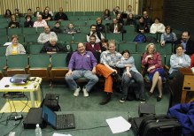 People in an auditorim looking up at the stage, taken from the stage