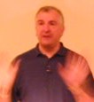 Closeup showing him using his hands while speaking