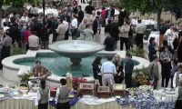 People standing around a fountain with buffet