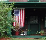 US Flag hanging on a porch