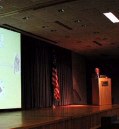 Stage with screen, US flag, lecturn