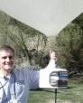 Man holding weather balloon with payload