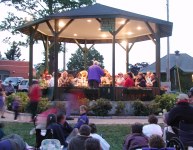 Band in gazebo in town center park at night