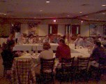 People around three tables at a restaurant