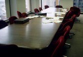 A conference table with papers on it