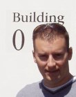 Jason next to Building 0 sign