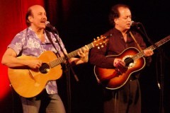 Two guys with guitars on stage