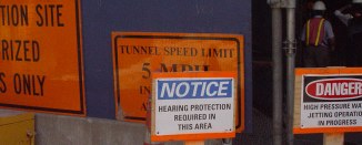 Signs: Noice: Hearing protection required, Danger: High pressure water jetting...