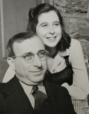 Black and White photo of smiling father with daughter