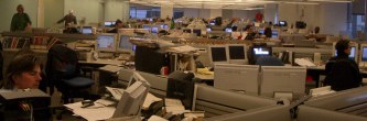 Lots and lots of low cubicles with screens and people