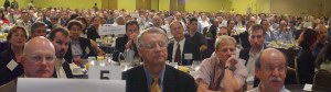 People listening at breakfast tables