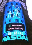 8 or more story tower with NASDAQ etc in bright lights